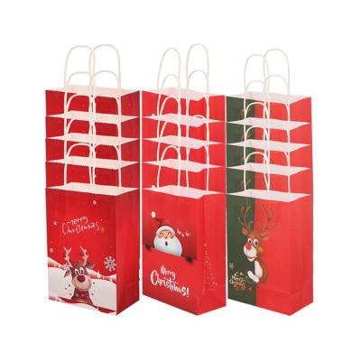 China Recycled Materials Wholesale Christmas Paper Gift Bag Packaging Merry Christmas Biodegradable Kraft Paper Shopping Bag for sale