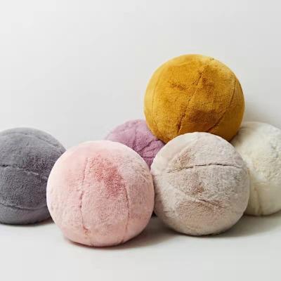 China Free Sample Folded Colorful Rabbit Fur Ball Pillow Super Soft Round Shaped Plush Stuffed Pillow for sale