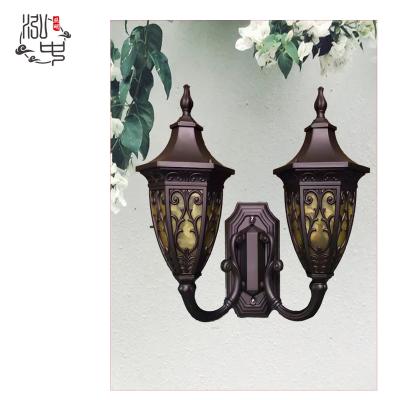 China Outdoor Garden Head Double Surface Mounted Wall Light Hot New Design Cafe Golden Classic Outdoor Waterproof Wall Lamp for sale