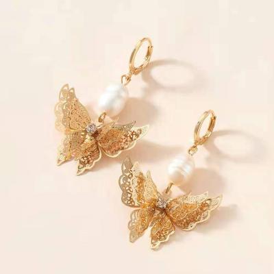 China New Fashion Metal Cavity Butterfly Layer Multi Romantic Temperament Baroque Freshwater Pearl Earrings for sale