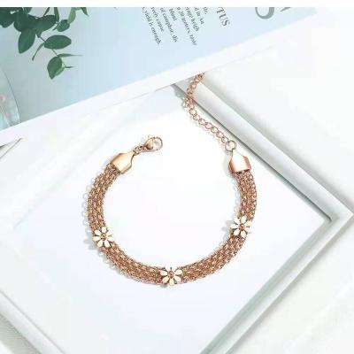 China Girls Romantic Hot Selling Gold Plated Stainless Steel Clover Woven Bracelet Fashion Lucky Bracelets Women for sale