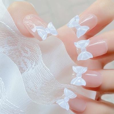 China Nail accessories wholesale mixed design high quality shiny decoration nail style resin bow nail accessories nail tip decoration for sale