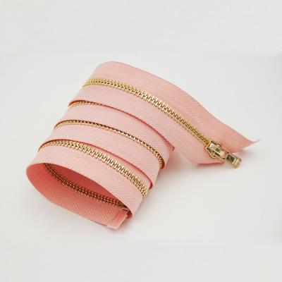 China # Environmental Friendly Opening Pink Handbag Strip 3 Metal Zipper Gold Prongs Zipper for sale