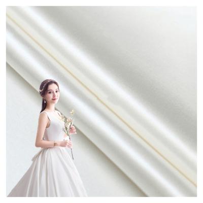 China 75*300D Duchess Bridal Satin Fabric For Shiny Colorful Stock Cheap Wedding Dress Half 160gsm Pearl White Polyester for sale