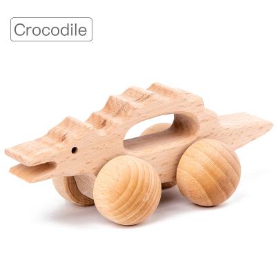 China Entertainment Toys Cute Baby Wooden Toy Animal Shape Holding Inertia Hand Cart For Kids 0-3 Years Molar Kids Toys Boy 2021 Educational for sale