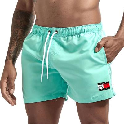 China Anti-Wrinkle Wholesale Customize Training Shorts Woven Athletics Lightweight Running Sports Gym Shorts Men Beach Shorts for sale