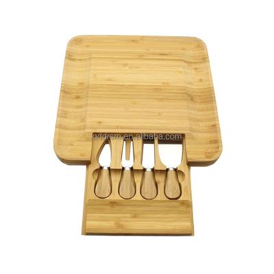 China Sustainable Popular Bamboo Cheese Board With Cutlery Cutting Plate With Slide-out Drawer for sale