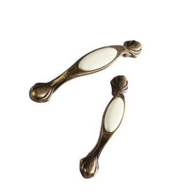 China Farmhouse Ceramic Spoon Foot Insert Drawer Pulls Cabinet Hardware Zinc Finish Statuary Bronze Cabinet Handles for sale