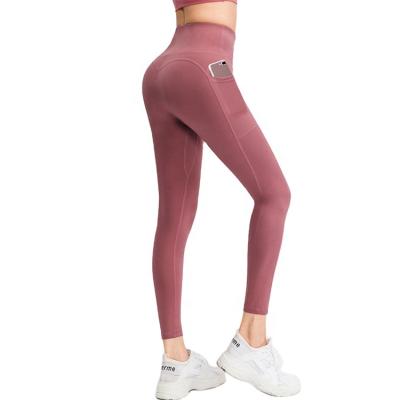 China Seamless Ladies Wholesale High Waist Yoga Gaiters Hip Pants Gym Sportswear Push Ups Ladies Workout Yoga Pants for sale