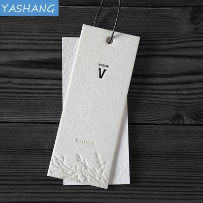 China paper & Cardboard 3D Blind Embossed Hole Punched Thickness Cotton Paper Label With Black Embossed Printing Cardboard Hit Tags for sale