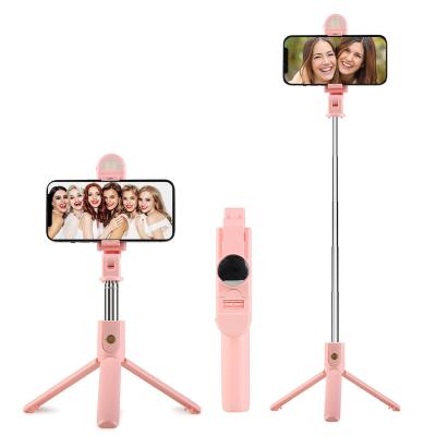 China Lightweight Rechargeable Wireless Remote Selfie Stick Tripod,Extendable Aluminum Phone Tripod Pink Selfie Stick with Fill Light for sale