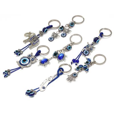 China Glass Elephant Turtle Evil Eye Turkey Car Key Chain Animal Key Chain Pendant for sale