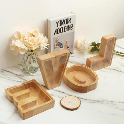 China Wooden Wooden Letters Change Creative Cute Retro Coin Piggy Bank Solid Wood Piggy Bank Home Decoration Ornaments for sale