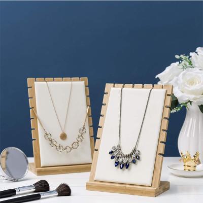 China KOREAN New Arrival Bamboo Wooden Frame Assemble Durable Beige PU Suede Necklaces Display Stand for sale