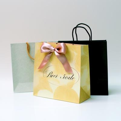 China Factory Hot Selling Recyclable Bags For Small Cosmetic Gift Paper Bags Ribbon Handles Garment Paper Bag for sale