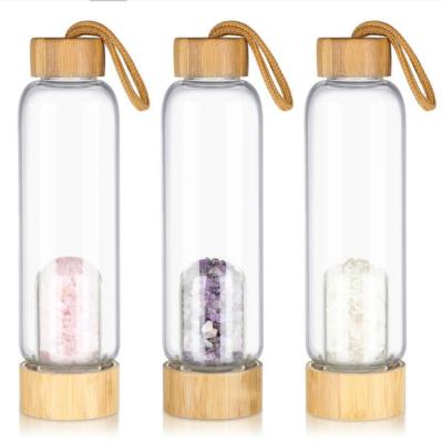 China 550ml Beverage Clear Gemstone Water Bottle With Cap Bamboo Natural Stones Glass Water Bottle for sale