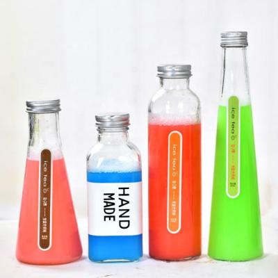 China 2020 Beverage Fashion New Beverage Cold Brew Glass Bottle With Aluminum Cap Round Juice Bottle Square Flat Shape Wine Container for sale