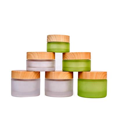 China Eco Friendly Empty Green Frosted Glass Cosmetic Cream Jar Of Personal Care 20ml 40ml 60ml Round Packaging With Cap for sale