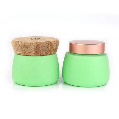 China Face Glass Jar 120g 4oz Custom Luxury Empty Green Cosmetic Facial Mud Containers Personal Care With Bamboo Lid for sale