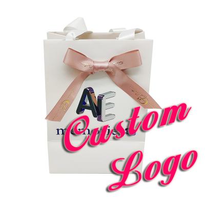 China Recyclable Luxury Custom Clothing Paper Shopping Bag For Gift With Ribbon Handle Ribbon Bow With Customize Gold Logo for sale