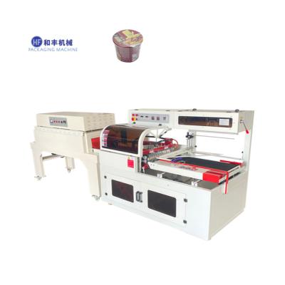 China Food Hefeng Machine Heat Shrink Packaging Machine For Instant Drum Noodles for sale