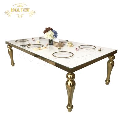 China Modern luxury event wedding gold stainless steel base with glass modern dining table set for sale