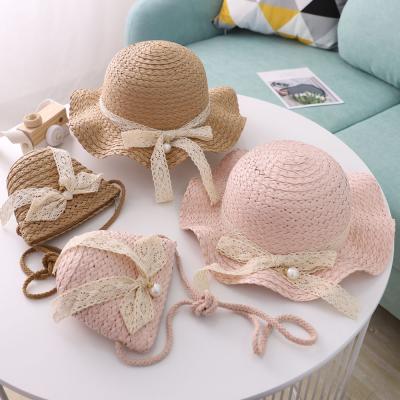 China Cute Daily Life Girls Straw Hat Girls Straw Ribbon Flower Sunshade Fisherman's Hat Sunscreen Straw Hat Bag Set for sale