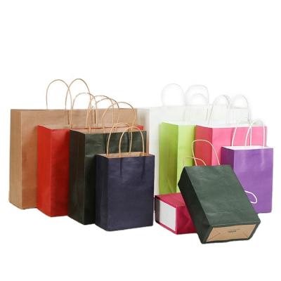 China Recyclable Wholesale Customized Food Grocery Gift Packing Bag With Handle Colorful Kraft Paper Bags Ready To Ship In Stock for sale