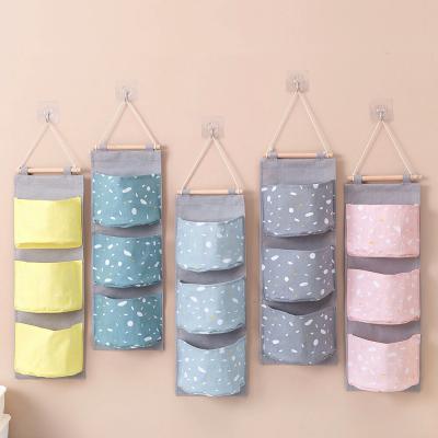 China 1 Sustainable MI Cotton Canvas 3 Pockets Wall Hanging Storage Bag Cabinet Cabinet Grocery Hanging Organizers For Room Bathroom for sale