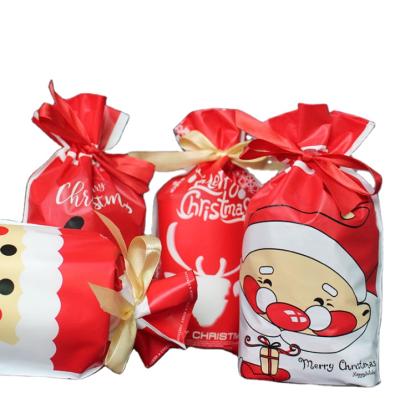 China Red and White New Christmas Elk Santa Claus PE Bag Gift Diagonal Pocket Group Stripes Candy Bag for sale