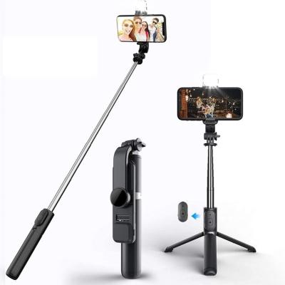 China 2021 new style L03S PORTABLE light weight 30 inch Phone Extendable Adjustable Tripod Wireless Remote Selfie Stick with LED Light for sale