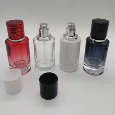 China Fancy Cosmetic Multi Colors Fashion NJ Round Cylinder 30ml Mini Refill Empty Glass Spray Perfume Bottle for sale