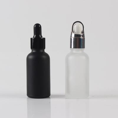 China Factory Chemical Supply Frosted Round 20ML Glass Essential Oil Bottles With Dropper Black Spray Glass Bottle for sale