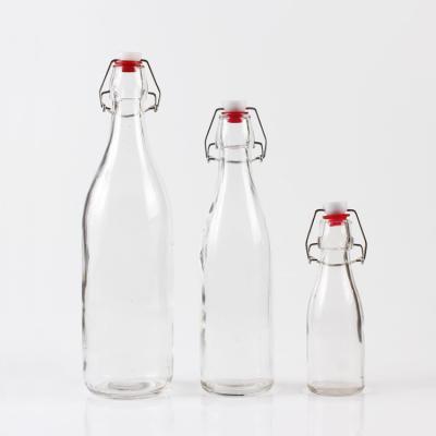 China wholesale chemical 120ml 500ml 900ml round clear glass beer bottle for alcohol for sale