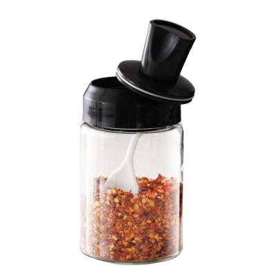 China Hot Selling 250ml Viable Lead Free Kitchen Seasoning Spoon And Lid Integrated Clear Round Glass Spice Jar for sale