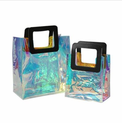 China Moisture-proof Clear Women Hands Shopping Holographic Clear PVC Cosmetic Plastic Tote Bag With Logo for sale