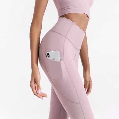 China New High Quality Women Breathable Sports Notched Legging With Pocket for sale