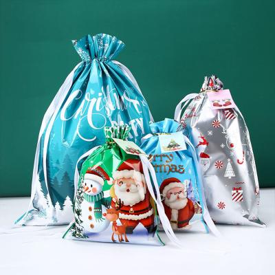 China Microwavable Xmas Gift Drawstring Bags Christmas Present Favors Storage Bag For Candy Gift Wrapping Pouches Xmas New Year Party Supplies for sale