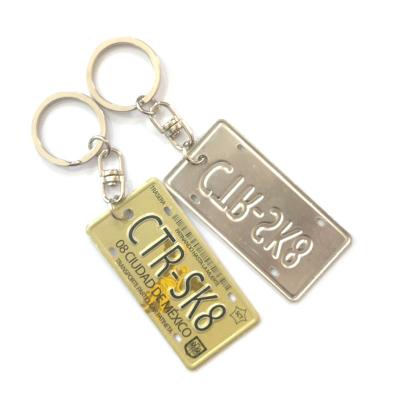 China Embossing 3*6cm Logo Raise Effect Promotion Aluminum License Plate Aluminum Key Chain for sale