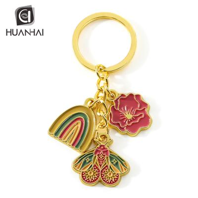 China Custom Metal Gifts Shaped Flowers Butterflies Soft Enamel Metal Key Chain Gold Plating for sale