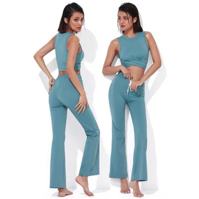 China Mini Breathable Flared Casual Soft Pants Yoga Suit Slimming Yoga Fitness Suit With Padded Chest Tank Top Set for sale