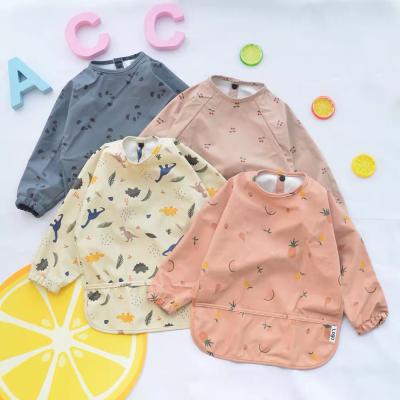 China Hot Sale Washable Long Sleeved Smocked Baby Bibs Waterproof Kids Clothing With Pocket Set Long Sleeve Baby Bibs for sale