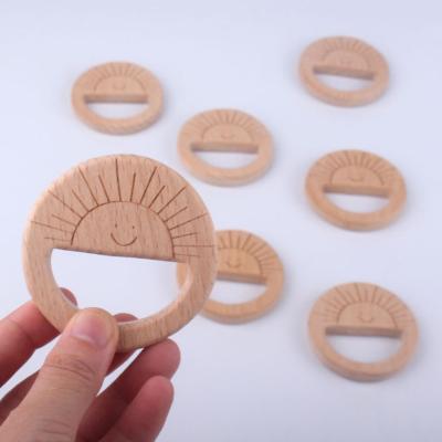 China Newest 2021 Newest Soft Custom Beech Wooden Cute Drinking Training Teething Toys Gift Children Kids Sun Chewable Molar Baby Teether for sale