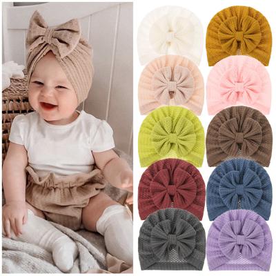 China Wholesale Soft Comfy Hair Accessories Indian Beanie Hat Big Bow Knot Autumn Baby Girl Hat Indian Hood Knit Waffle Cloth Baby Turban Headband for sale