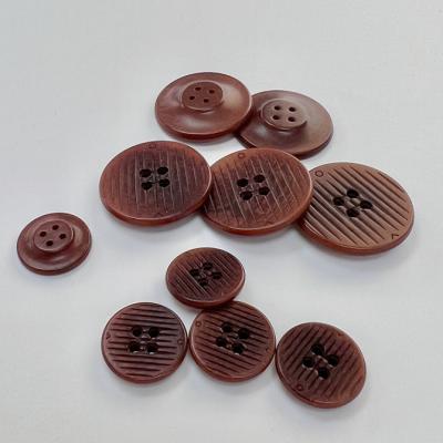 China High quality dry cleaning and environmentally friendly fruit buttons, customized four hole coat buttons for sale