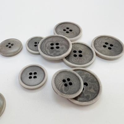 China Dry Cleaning Customized Circular Four Hole Suit Button With High Quality And Environmentally Friendly Fruit Buckle for sale