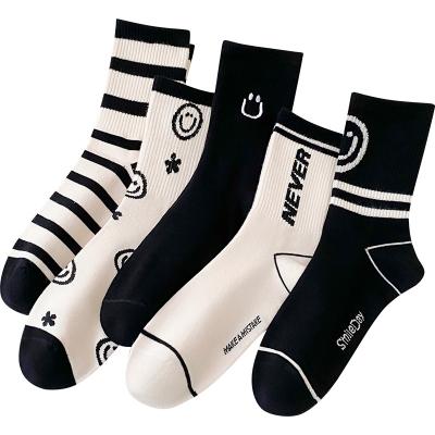 China Best Selling Breathable Fashion Cotton Mid Calf Length Cotton Teens Girls Street Style Black White Striped Socks for sale