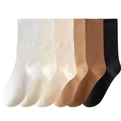 China Trend Breathable Warm Pure Color Sock Mid Calf Length Cotton Teens Girls Autumn Style Loose Socks for sale