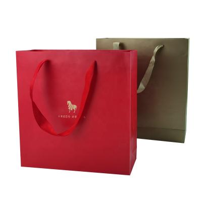 China Wholesale zy recyclable famous brand gift bag custom kraft paper shopping bags with logo for sale