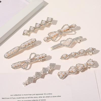 China New fashion friendly rhinestone hairpin alloy material bead hits platypus heart-shaped clip rhinestone bead clip for sale